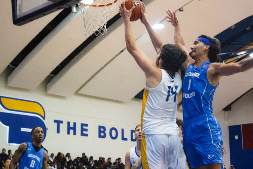 A TMU player attempts to shoot