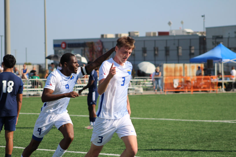 Noah Bickford and Cyrus Rollocks celebrate
