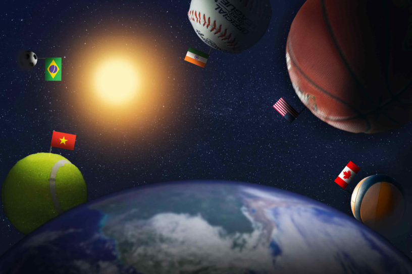 Illustration of the globe on the bottom of the frame with five sports balls floating around it. Each sports ball has a different countries flag on it.