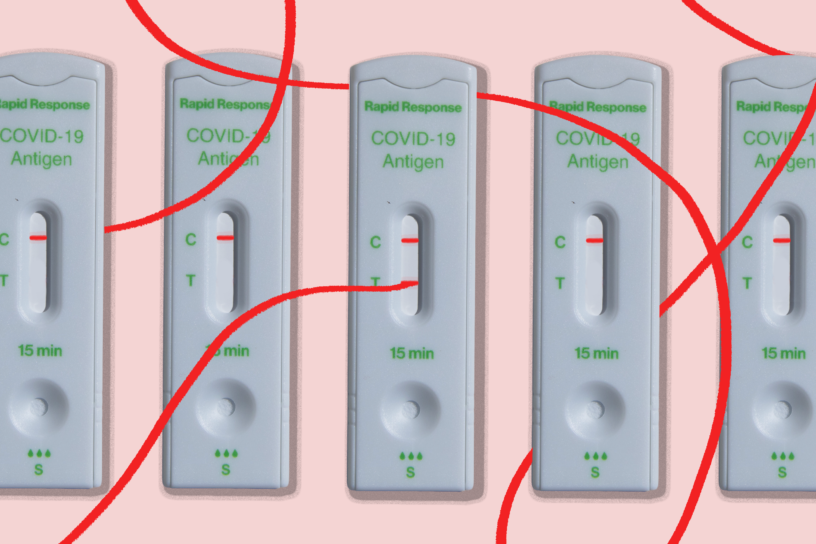 Five COVID-19 rapid test devices. One is positive and has a line extending from the positive line around the other tests.