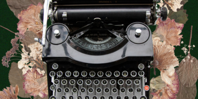 Collage of a typewriter with the keys in Inuktitut syllabics. There are pressed flowers on top of a green background around the typewriter.