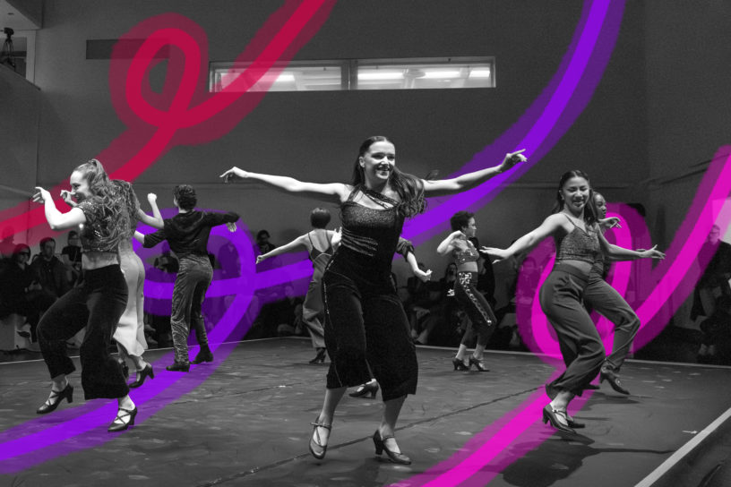 Black and white image of people dancing with their arms out, they are all smiling. There are red, purple and pink line illustrations in the background.