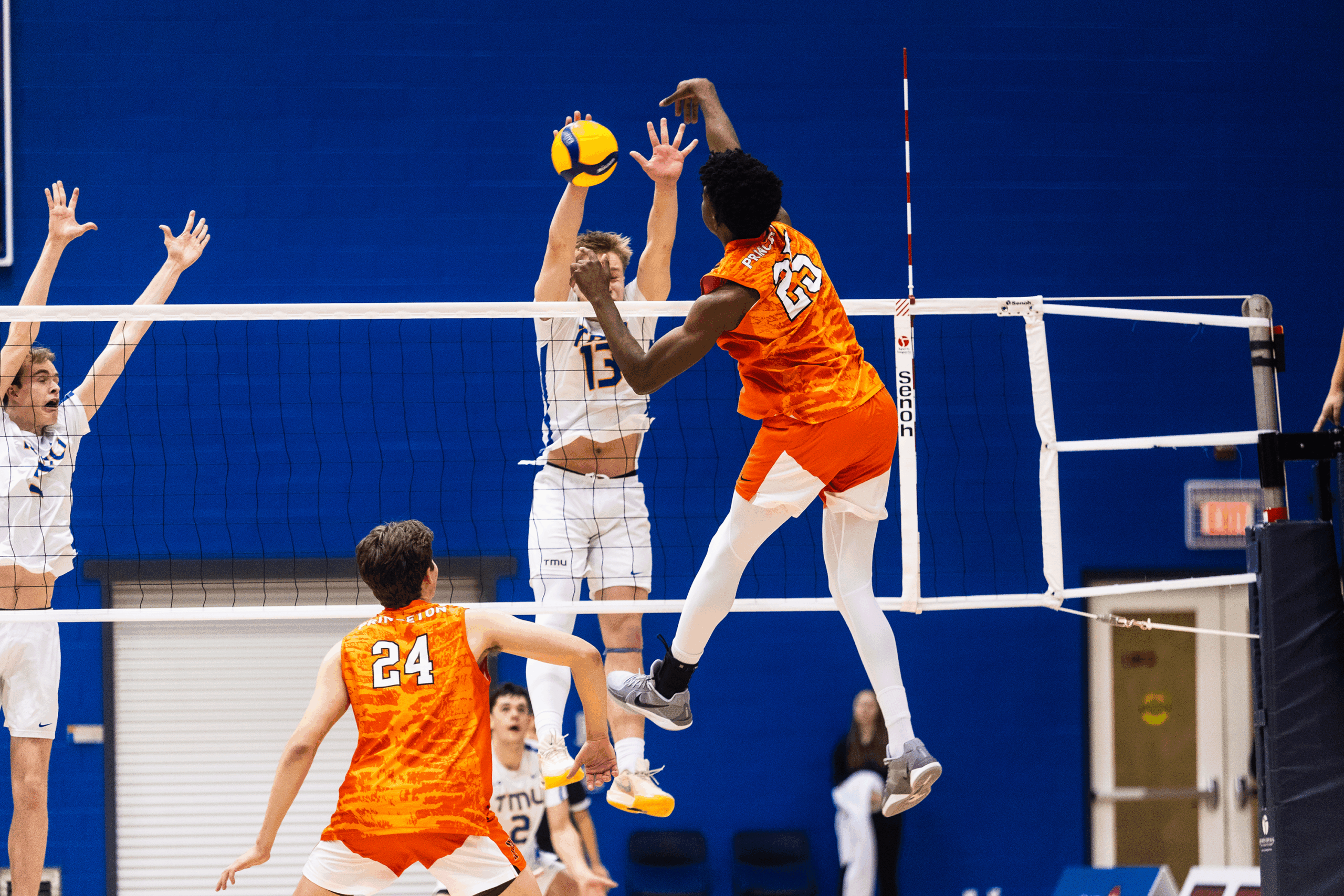 Princeton sends the ball over a TMU blocker