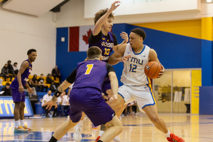 TMU player double teamed