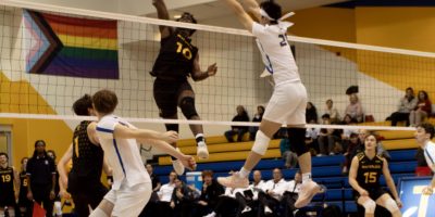 TMU tries to block a shot from Waterloo